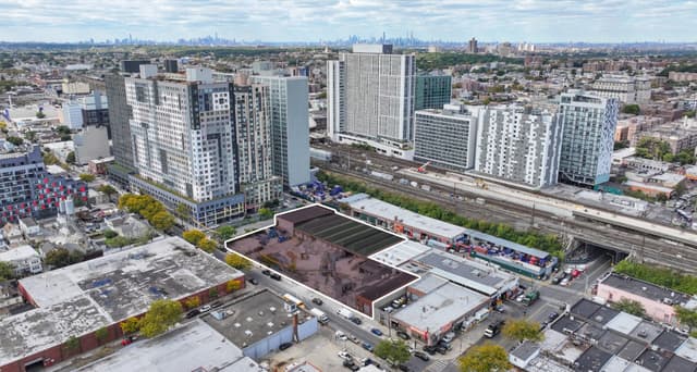 Aerial view of Jamaica Development Assemblage at 149-01 95th Avenue in Queens, New York, with the Manhattan skyline visible in the background, exclusively listed by Matthews™