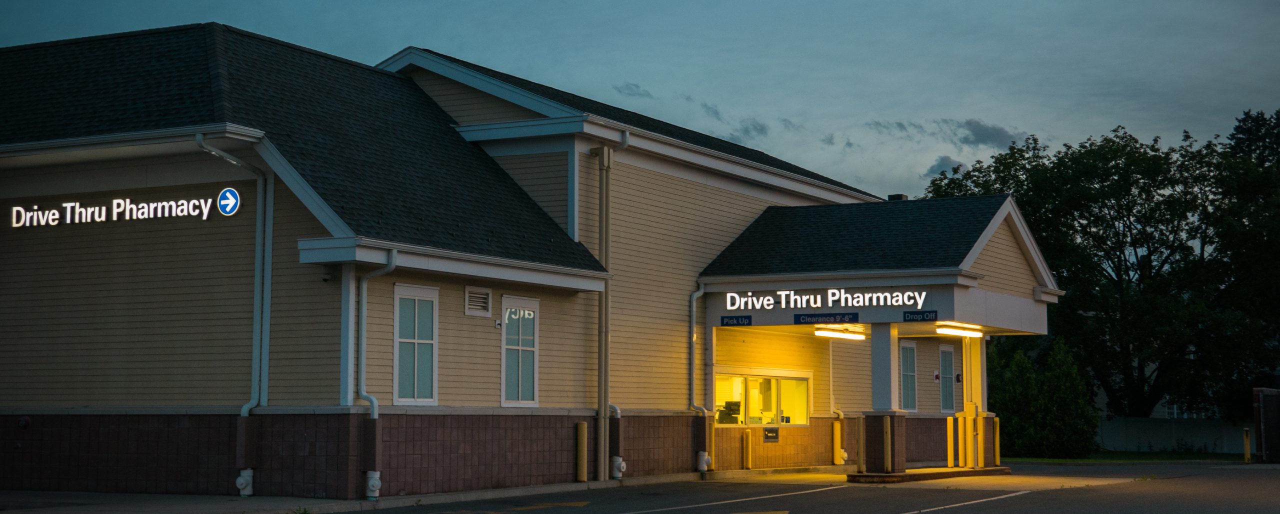 A retail pharmacy drive thru at dawn